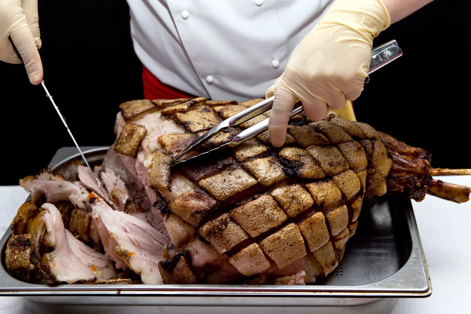 Pork. Chef cuts baked meat. Pork. Chef cuts baked meat.